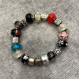 Multiple charmed silver bracelet